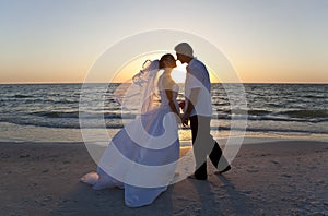 Bride & Groom Couple Kissing Sunset Beach Wedding