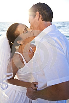 Bride & Groom Couple Kissing Sunset Beach Wedding