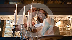 Bride and groom cut wedding cake