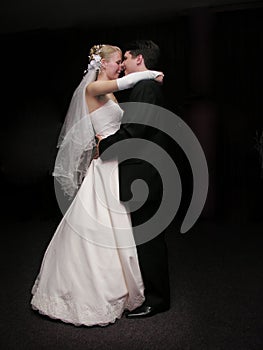 Bride and groom dancing in the dark