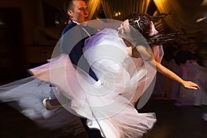 bride and groom dancing