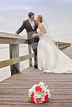 Bride and groom on dock