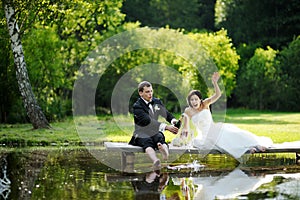 Bride and groom drinking champagne