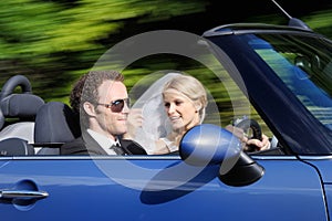 Bride and groom driving to their bright future