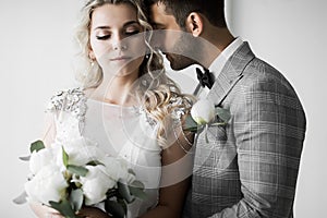 The bride and groom embrace on the wedding day. selective focus.