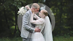 The bride and groom enjoy each other in an embrace.