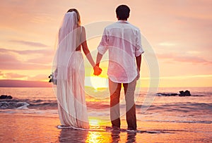 Bride and Groom, Enjoying Amazing Sunset on a Beautiful Tropical beach