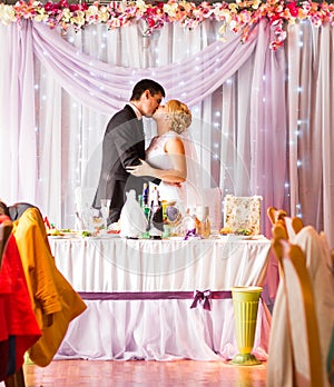 Bride And Groom Enjoying Meal At Wedding Reception