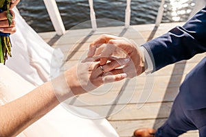 The bride and groom are exchanging rings.