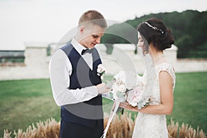 Bride and groom exchanging wedding rings. Stylish couple official ceremony