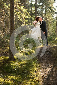 Bride and Groom in Forest with Soft Focus