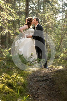 Bride and Groom in Forest with Soft Focus