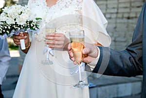 Bride and groom with glasses of champagne