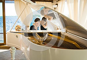 Bride and groom at the grand piano