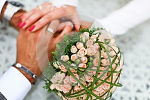 Bride and groom hand in hand together