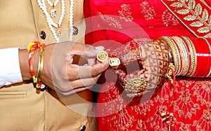 Bride and groom hands holding & showing wedding Jewelry Rings