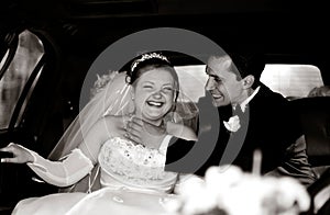 Bride and Groom having fun in a limo