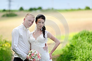 Bride and groom having a romantic moment on their wedding