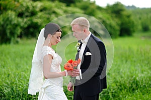 Bride and groom having a romantic moment on their wedding