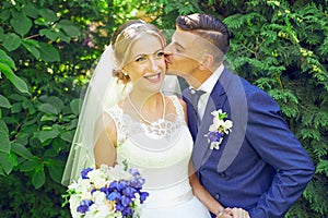 Bride and groom having a romantic moment on their wedding day