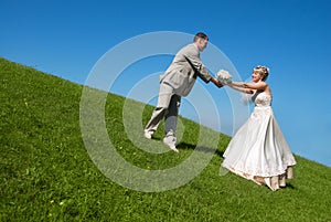 Bride and groom on the hill