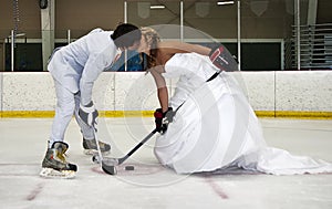 Bride and Groom hockey face off