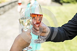 Bride and groom holding beautifully wedding glasses with champaign sparkling wine toast