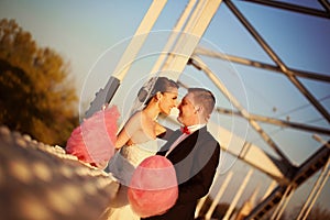 Bride and groom holding a candy floss