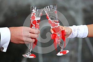 Bride and groom holding champagne glasses. Champagne Toast . Wedding glasses in their hands