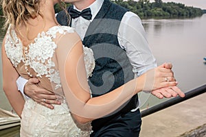 Bride and groom holding hands