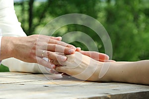 Bride and groom holding hands