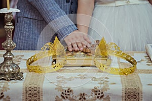 Bride and groom holding hands in the church