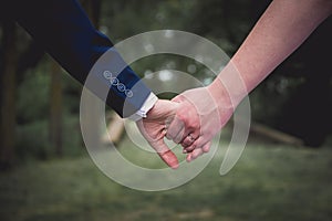 Bride and groom holding hands on the wedding day