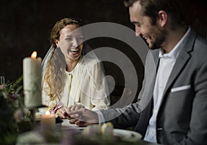 Bride and Groom Holding Hands on Wedding Reception