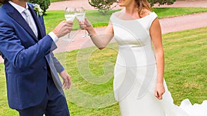 Bride and groom holding wedding champagne glasses