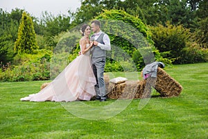 Bride and groom holding wine glasses