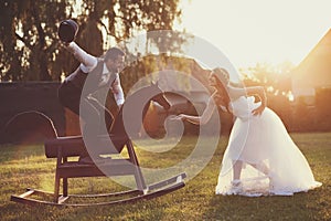 Bride and groom with a horse