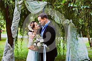 Bride and groom are hugging