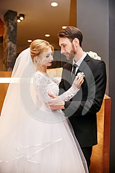 Bride and groom hugging and kissing on their wedding day. Creating a new family, a happy couple in love, a Man and a woman love e