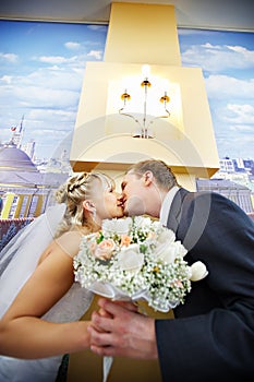 Bride and groom in interiors of marriage palace