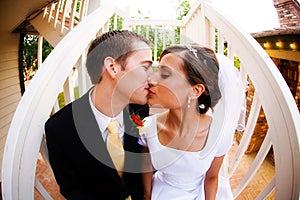 Bride and groom kiss