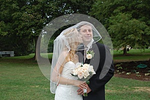 Bride and Groom Kiss on Cheek