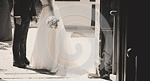 Bride and groom kiss outside the church