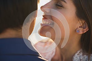 Bride and groom kisses tenderly. Sexy kissing stylish couple of lovers close up portrait.