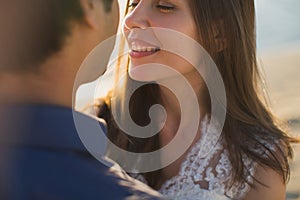 Bride and groom kisses tenderly. Sexy kissing stylish couple of lovers close up portrait.