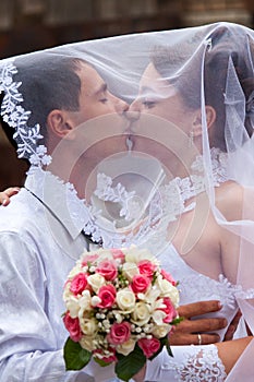 Bride and groom kissing