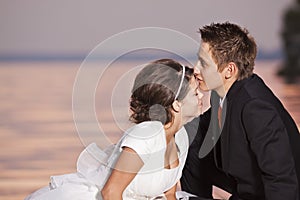 Bride and groom kissing