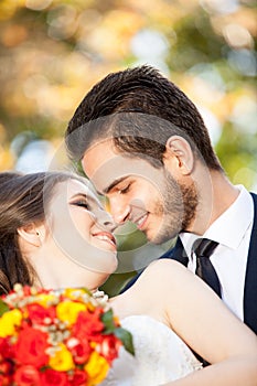 Bride and groom kissing each other