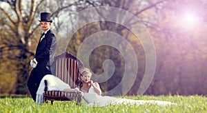 The bride and groom on the lawn in the forest