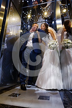 Bride and groom in lift